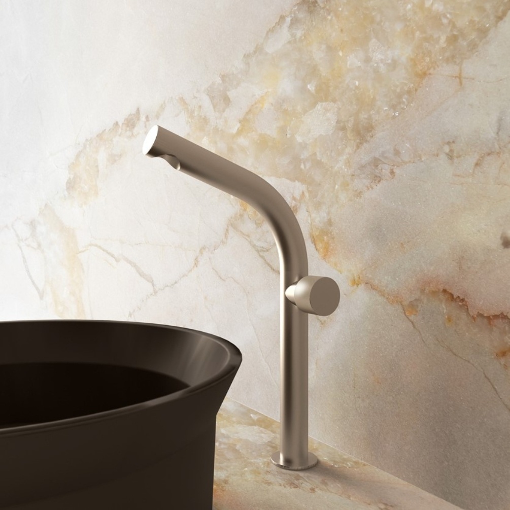 Lifestyle image of the Crosswater Ixora Stainless Steel Tall Basin Mixer installed behind a countertop basin